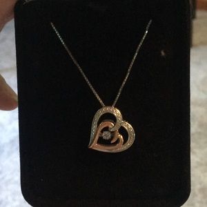 Diamonds in motion heart necklace